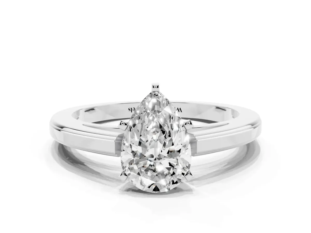 Pear Cut Solitaire Diamond Ring with Four-Prong Setting and Classic Band Platinum