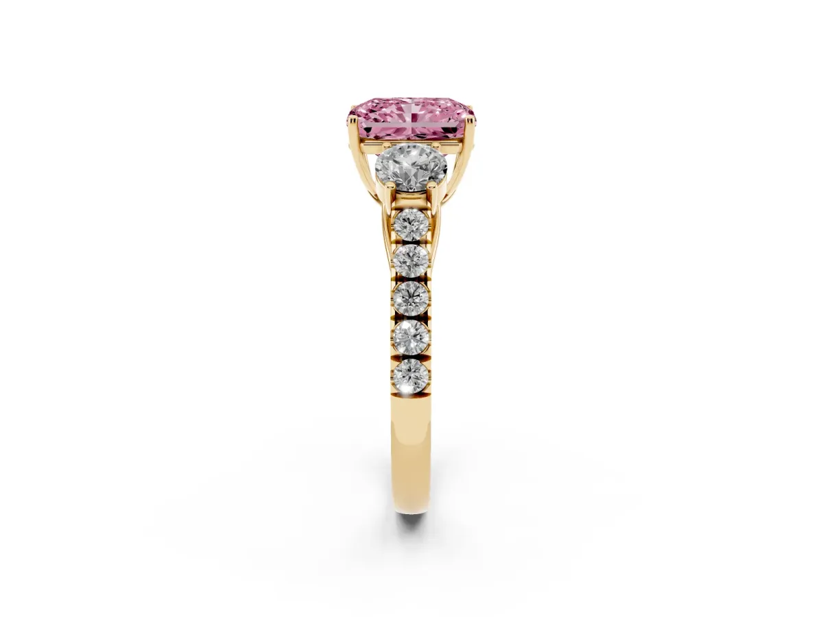 Fancy Pink Radiant Cut Cut Diamond Three-Stone Ring with Round Side Stones and Pavé Band Yellow gold