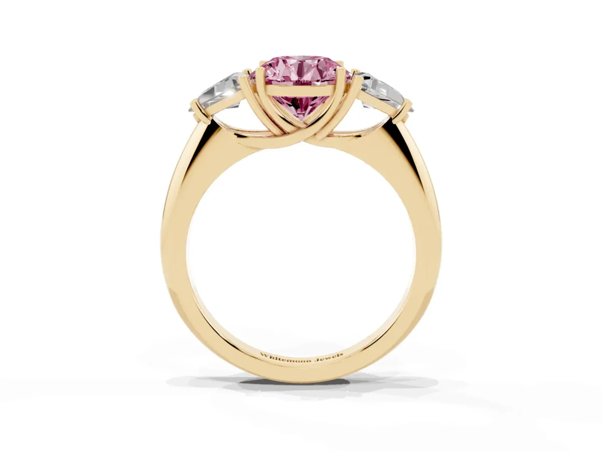 Fancy Pink Three-Stone Round Cut Diamond Engagement Ring with Trillion Side Stones and Prong Setting Yellow gold