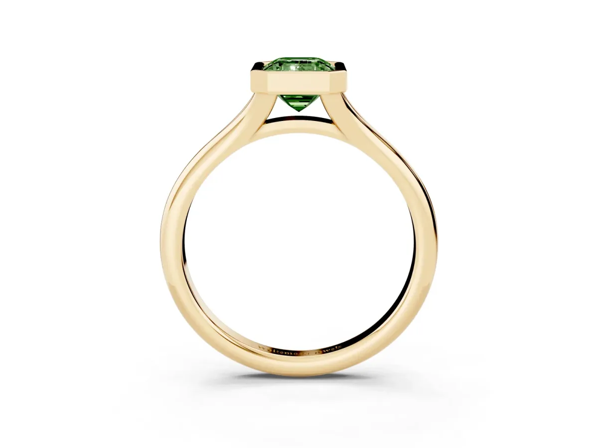 Fancy Green Bezel Set Emerald Cut Solitaire Diamond Ring with Smooth Band Yellow gold