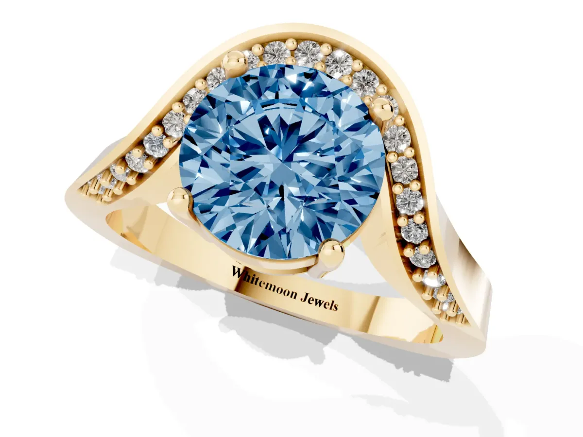 Fancy Blue Round Cut Solitaire Diamond Engagement Ring with Pave Band and Four-Prong Setting Yellow gold