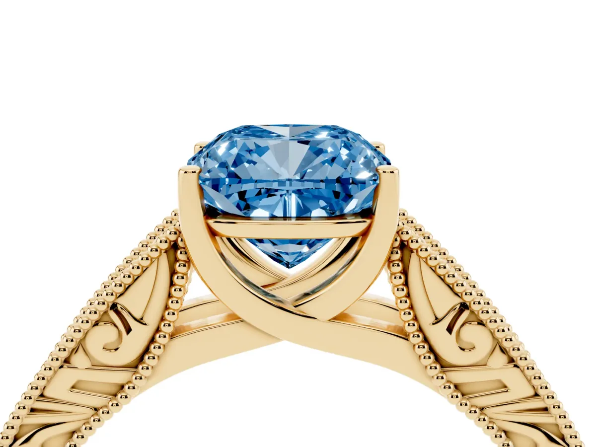 Fancy Blue Cushion Cut Diamond Solitaire Ring with Engraved Band and Four-Prong Setting Yellow gold