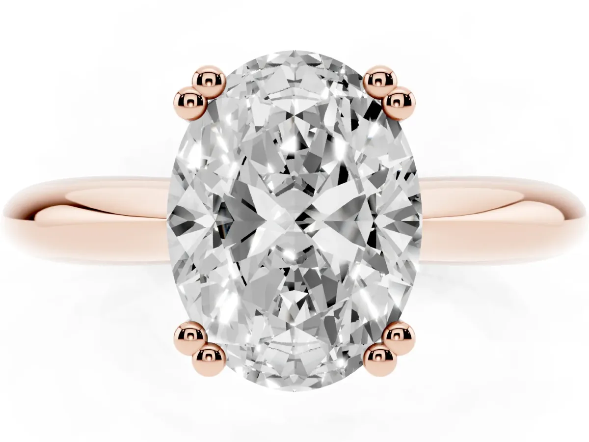 Oval Cut Cut Solitaire Engagement Ring with Tapered Band and Four-Prong Setting Rose gold