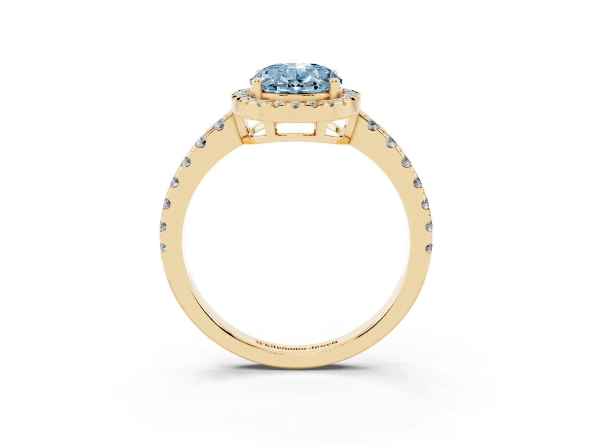 Fancy Blue Oval Cut Diamond Halo Ring with Pavé Band and Four-Prong Setting Yellow gold