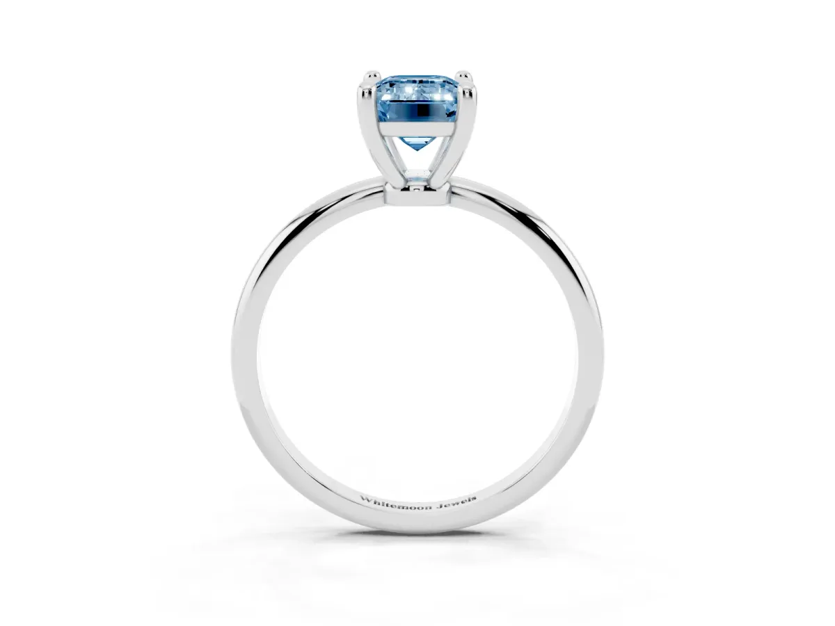 Fancy Blue Emerald Cut Solitaire Diamond Ring with 4-Prong Setting on a Classic Band Platinum