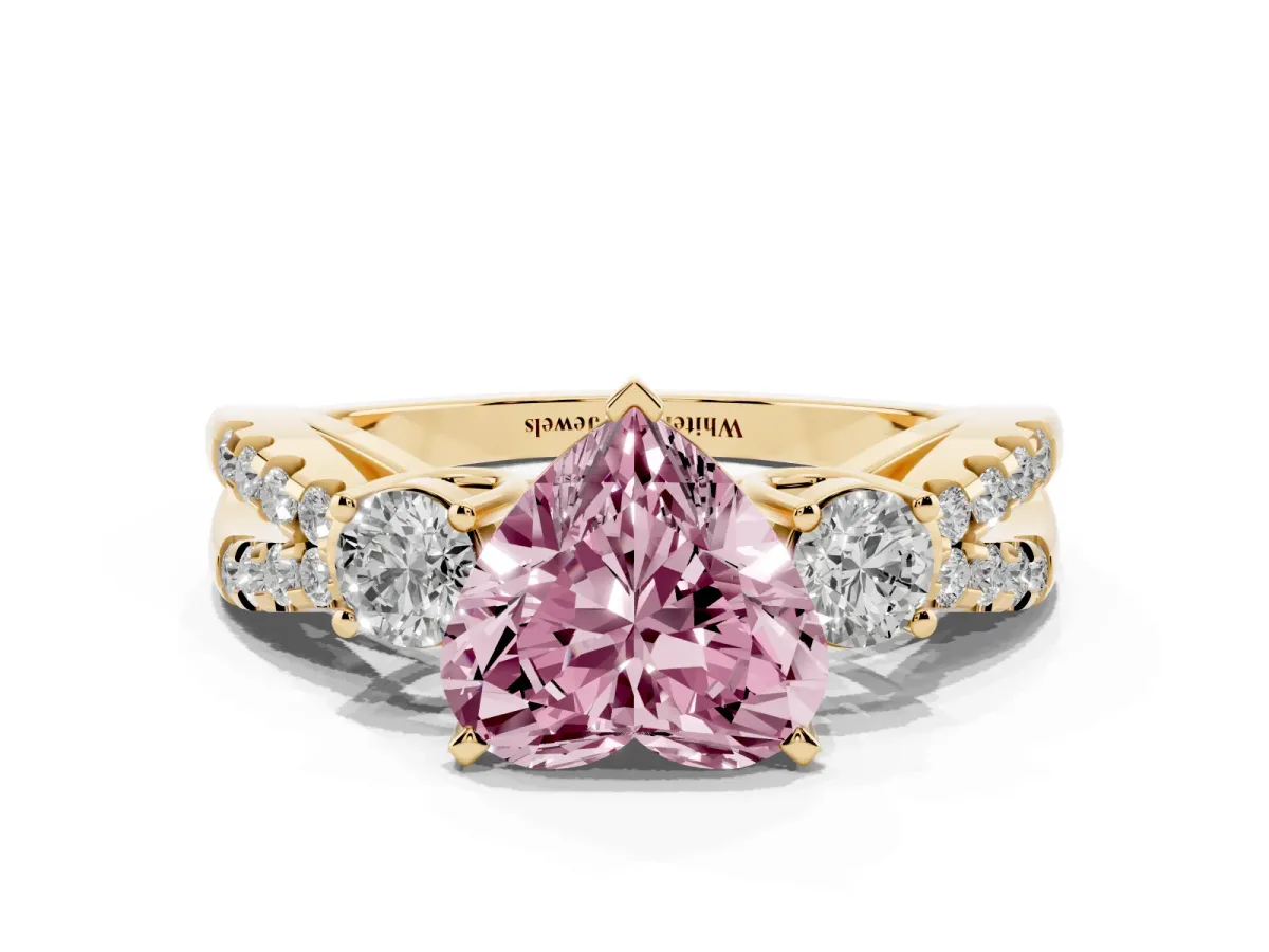Fancy Pink Heart Cut Diamond Three-Stone Ring with Pavé Split Shank and Four-Prong Setting Yellow gold