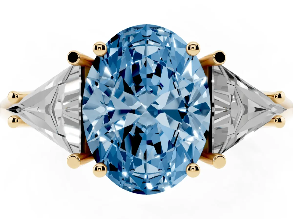 Fancy Blue Three-Stone Oval Cut Diamond Engagement Ring with Trillion Side Stones and Prong Setting Yellow gold