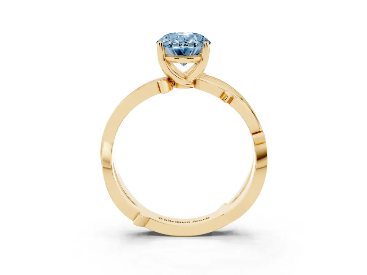Fancy Blue Oval Cut Solitaire Twist Band with Pavé Accents and Four-Prong Setting Yellow gold