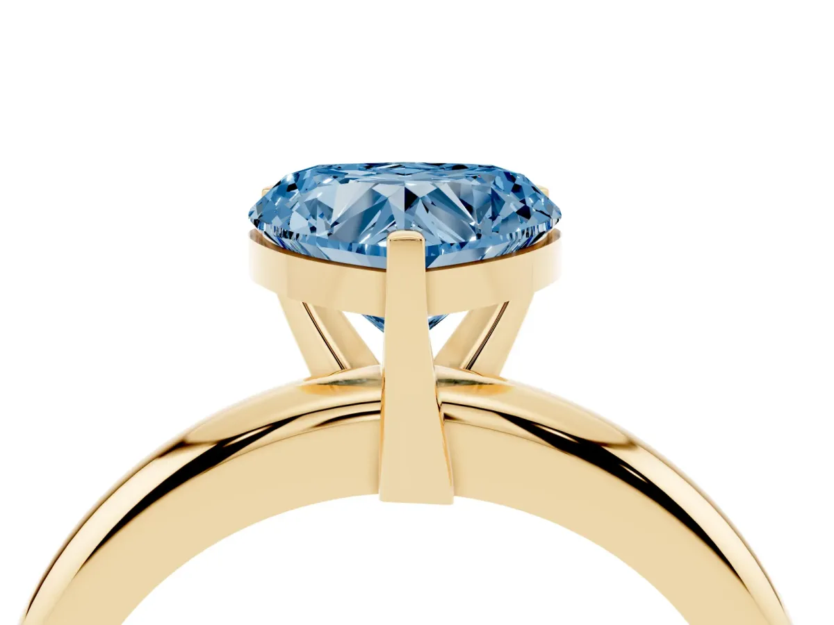 Fancy Blue Heart Cut Diamond Solitaire Engagement Ring with Round Band and Four-Prong Setting Yellow gold