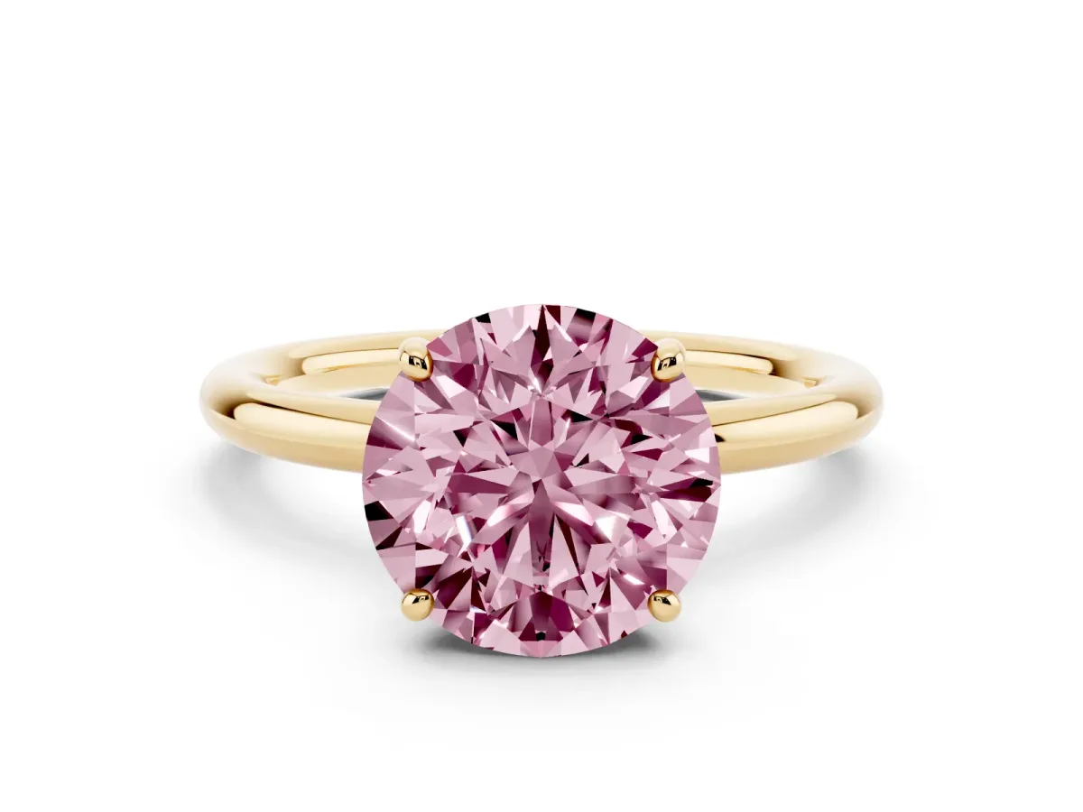 Fancy Pink Round Cut Solitaire Diamond Ring with Four-Prong Setting on a Plain Band Yellow gold