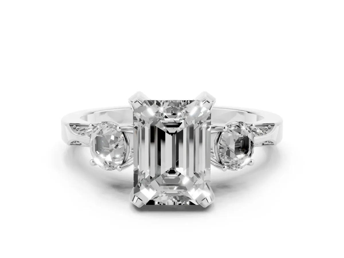 Fancy Pink Emerald Cut Brilliant Three-Stone Diamond Ring with Pavé Band and Four-Prong Setting White gold