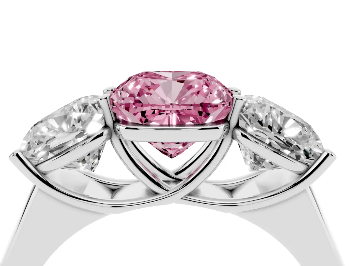 Fancy Pink Cushion Cut Three-Stone Diamond Ring with Prong Setting on a Classic Band Platinum