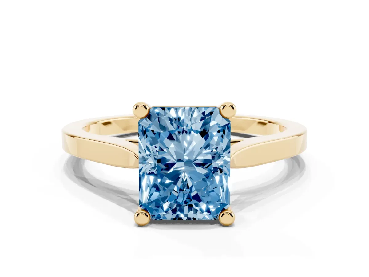 Fancy Blue Radiant Cut Solitaire Diamond Ring with Four-Prong Setting and Tapered Band Yellow gold