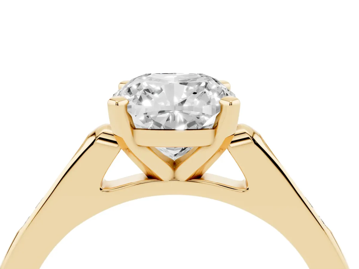 Cushion Cut Diamond Solitaire Ring with Channel Set Round Band and Prong Setting Yellow gold