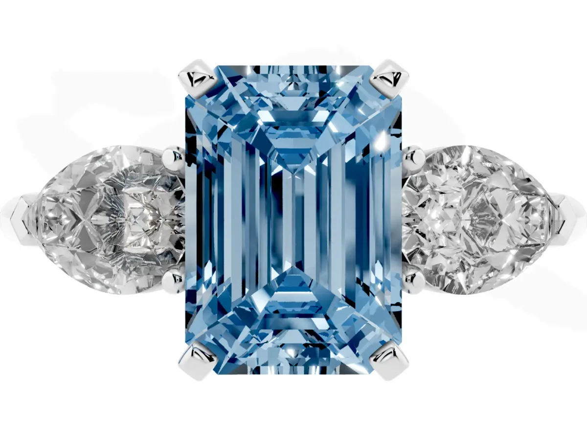 Fancy Blue Three-Stone Emerald Cut Diamond Ring with Pear Side Stones and Four-Prong Setting Platinum