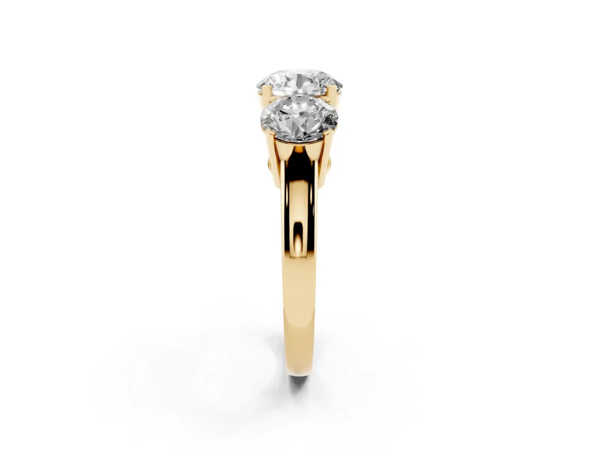 Three-Stone Round Cut Cut Diamond Ring with Channel Set Band and Four-Prong Setting Yellow gold