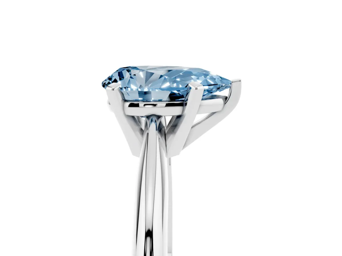 Fancy Blue Pear Cut Cut Solitaire Ring with Four-Prong Setting on a Classic Band Silver