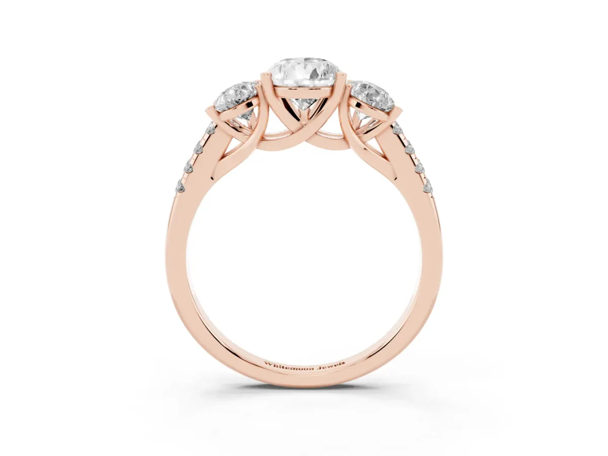 Three-Stone Pear Cut Diamond Ring with Round Pavé Band and Prong Setting Rose gold