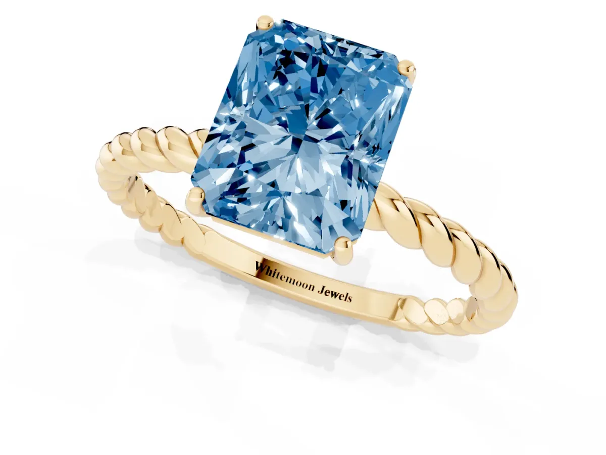 Fancy Blue Radiant Cut Solitaire Twist Band Ring with Four-Prong Setting Yellow gold