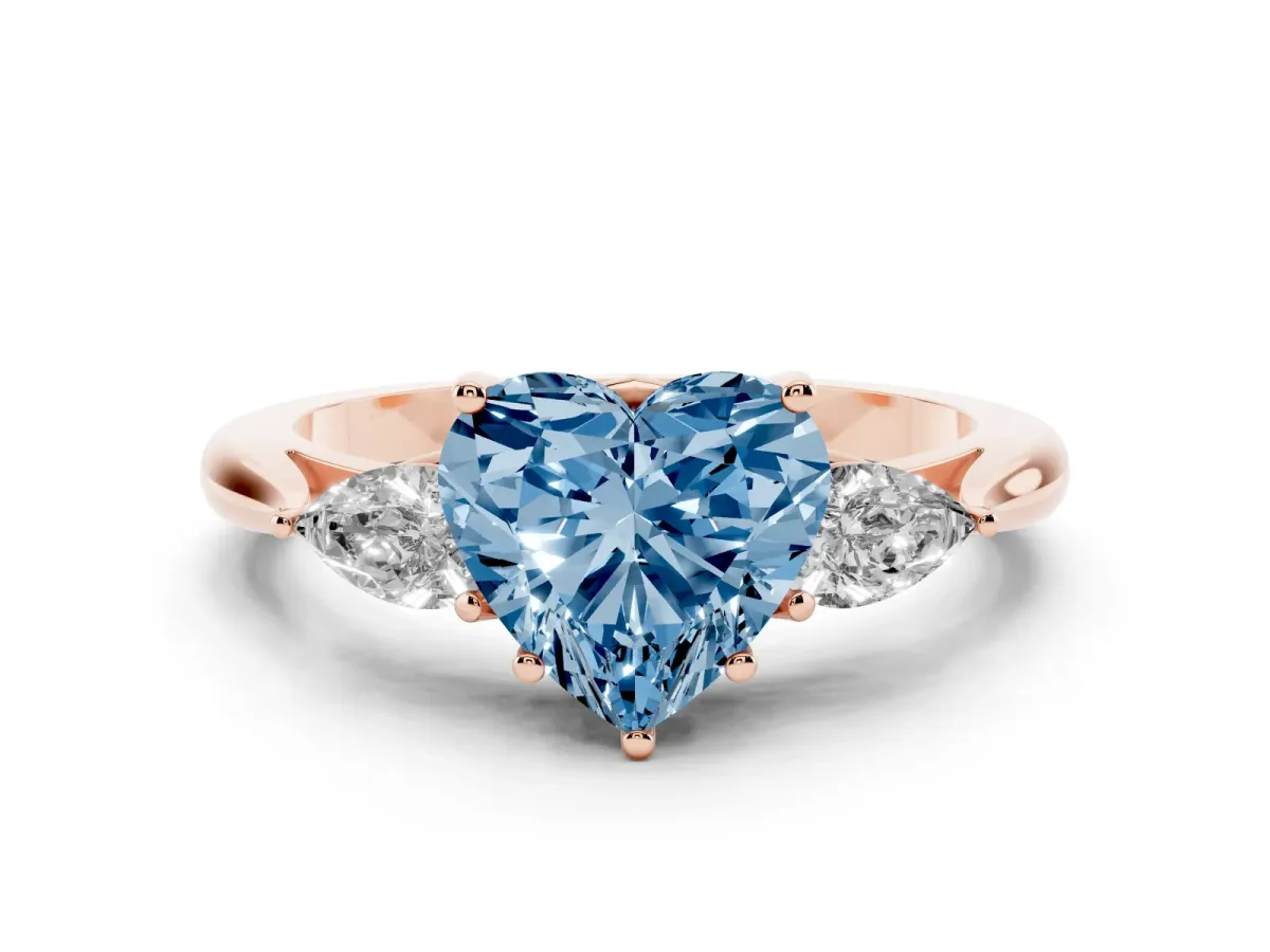 Fancy Blue Three-Stone Heart Cut Diamond Ring with Pear Side Stones in Four-Prong Setting Rose gold