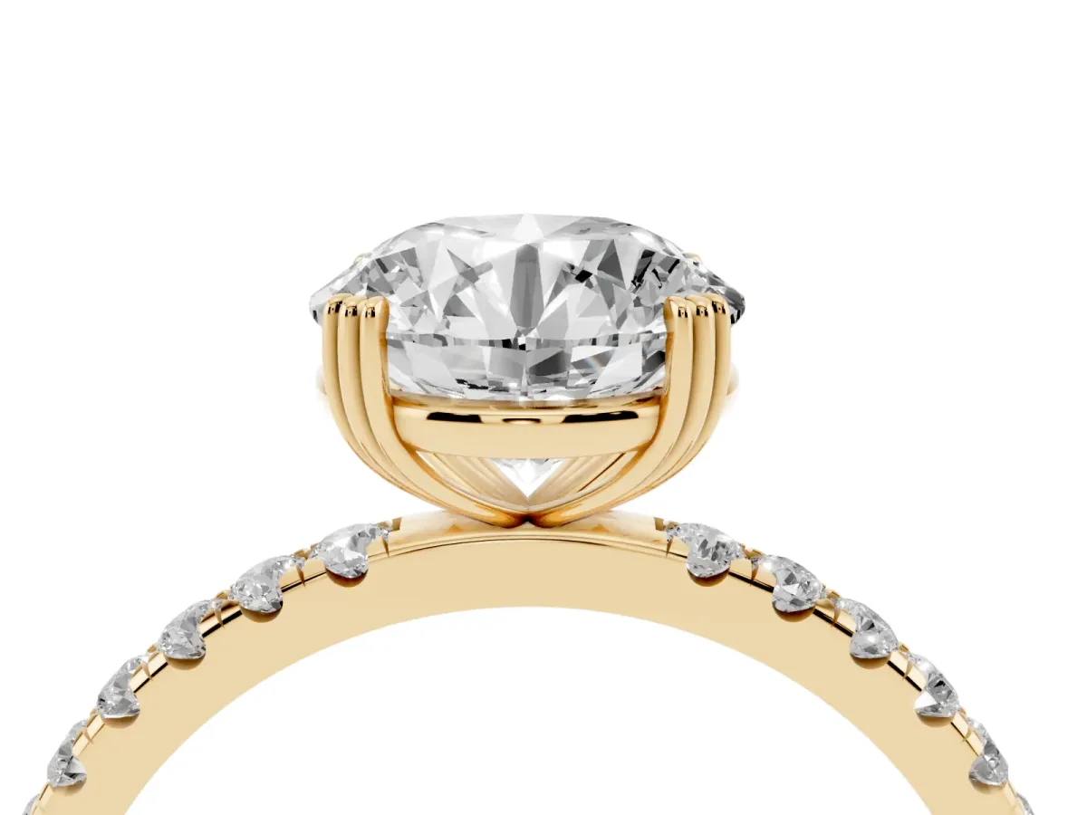 Round Cut Brilliant Solitaire with Pavé Band and Claw Prong Setting Yellow gold