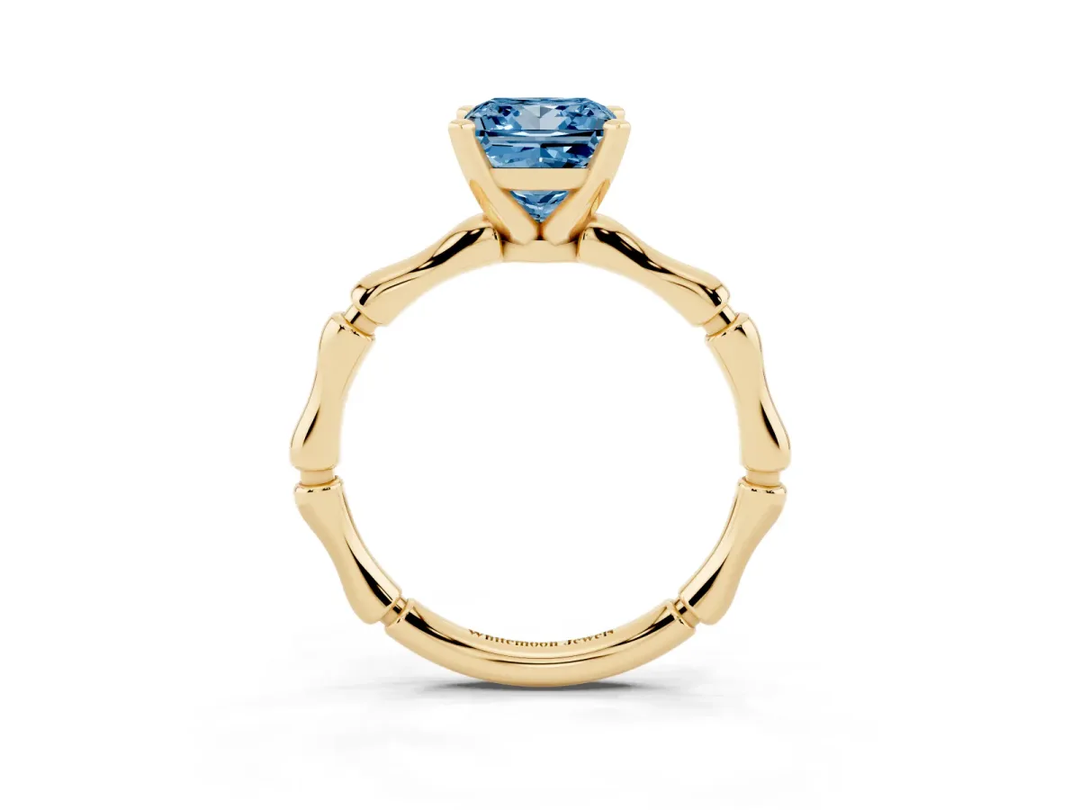Fancy Blue Princess Cut Solitaire Diamond Ring with Bamboo Band and Four-Prong Setting Yellow gold
