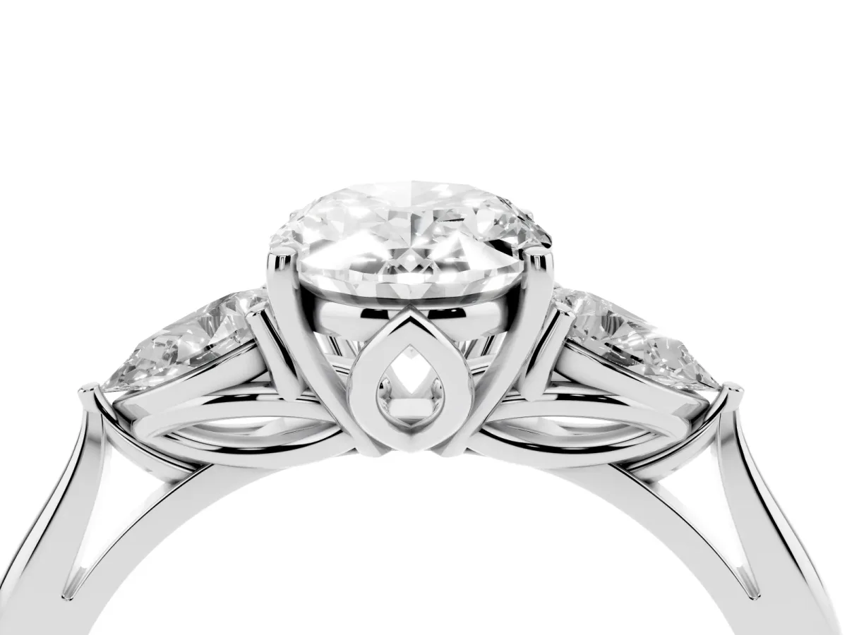 Three-Stone Oval Cut Diamond Ring with Pear Side Stones in Four-Prong Setting Platinum