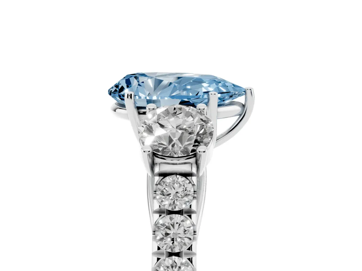 Fancy Blue Pear Cut Cut Diamond Three-Stone Ring with Round Side Stones and Pavé Band Silver