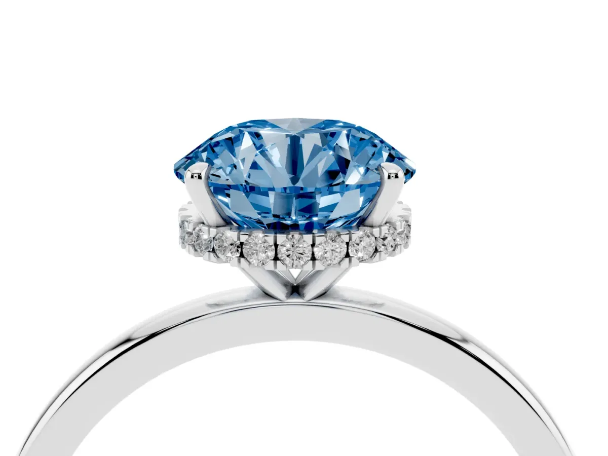 Fancy Blue Round Cut Solitaire Engagement Ring with Cathedral Band and Four-Prong Setting Silver