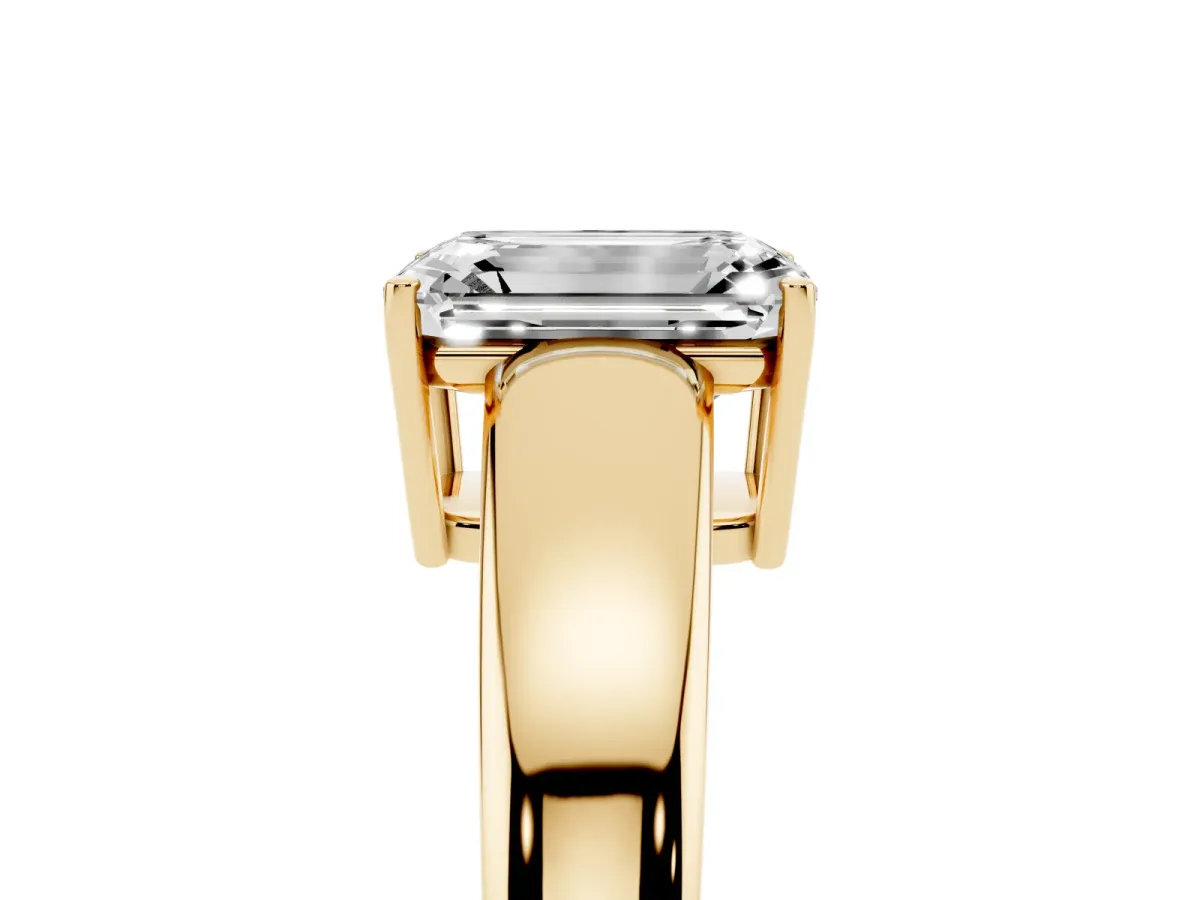 Emerald Cut Solitaire Diamond Ring with Tapered Band and Four-Prong Setting Yellow gold
