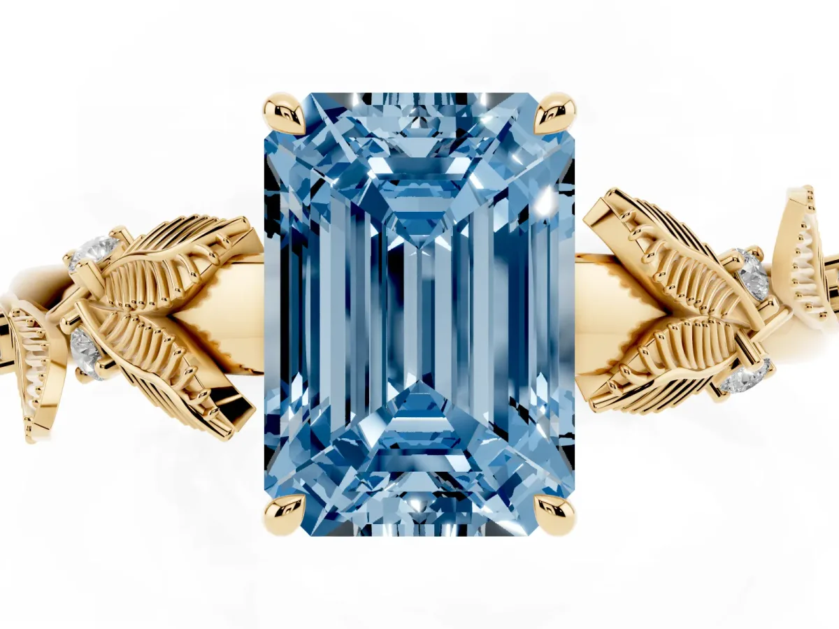 Fancy Blue Emerald Cut Diamond Solitaire Ring with Leaf Motif Band and Four-Prong Setting Yellow gold