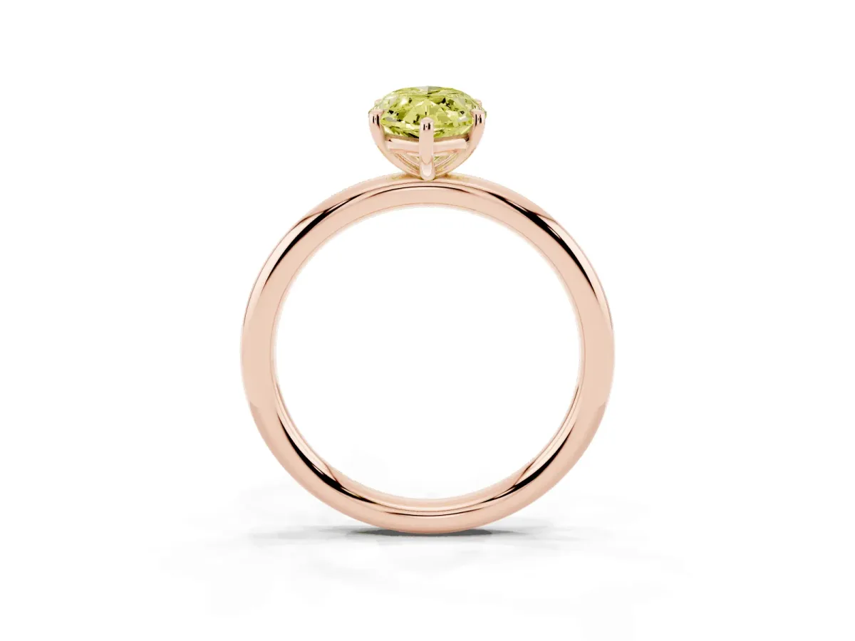 Fancy Yellow Oval Cut Solitaire Diamond Ring with Four-Prong Setting on a Plain Band Rose gold