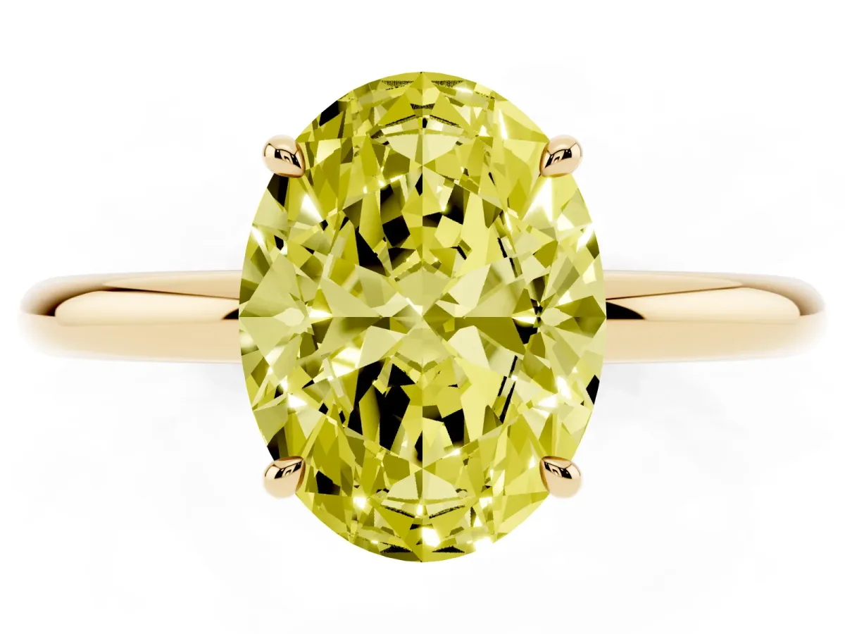 Fancy Yellow Oval Cut Diamond Solitaire Ring with Thin Band and Four-Prong Setting Yellow gold