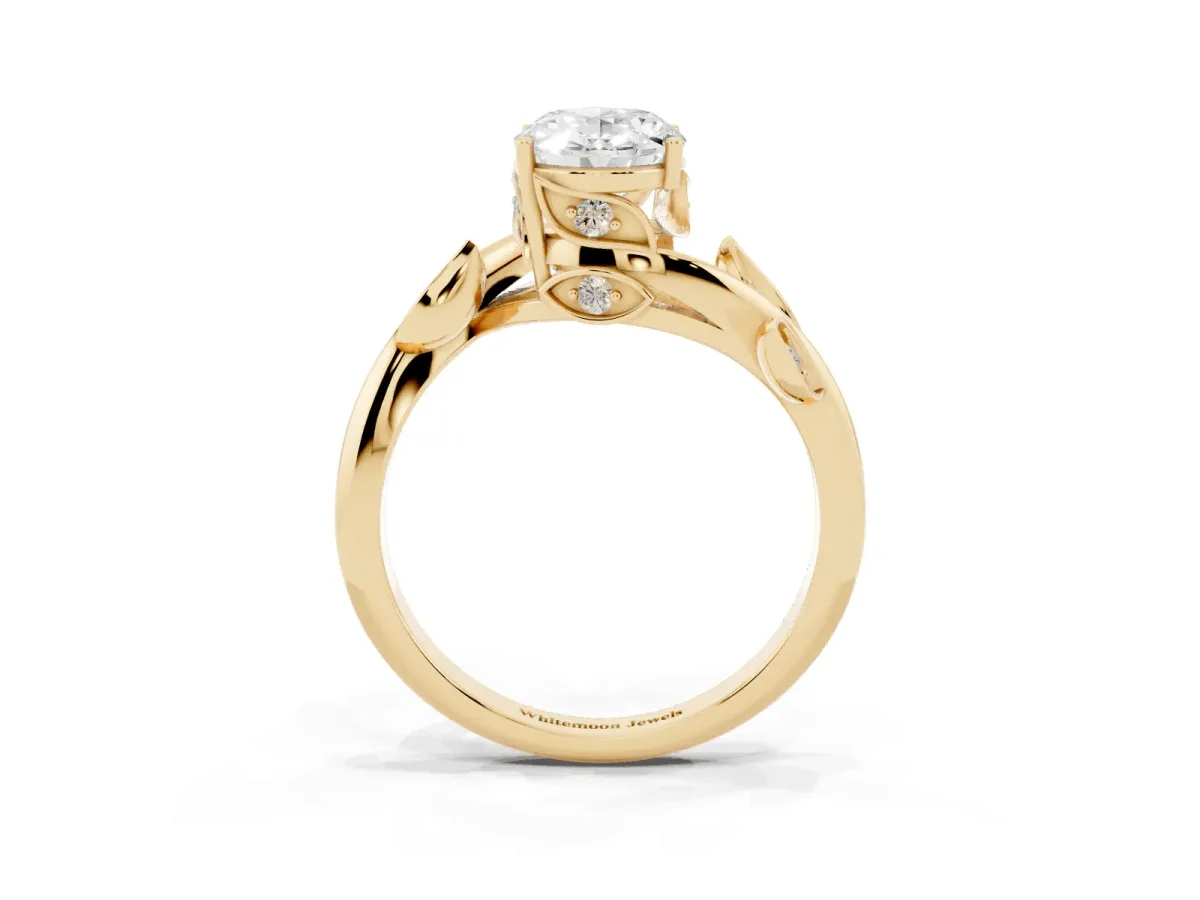 Oval Cut Solitaire Twist Engagement Ring with Leaf Accents and Prong Setting Yellow gold
