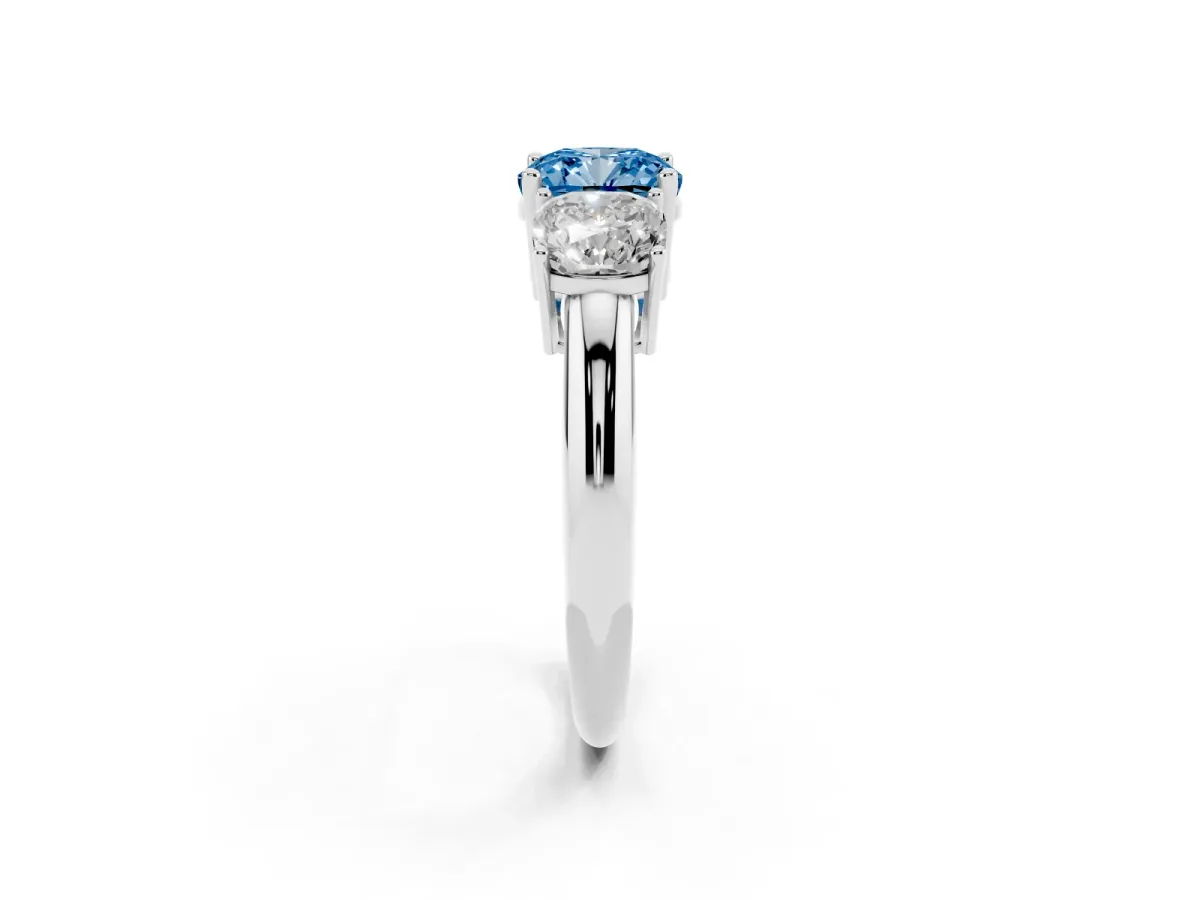 Fancy Blue Three-Stone Cushion Cut Cut Diamond Engagement Ring with Prong Setting on a White Gold Band Platinum