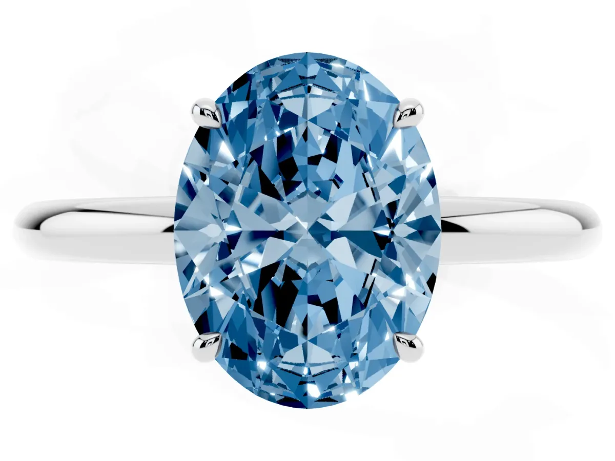 Fancy Blue Oval Cut Diamond Solitaire Ring with Thin Band and Four-Prong Setting Silver