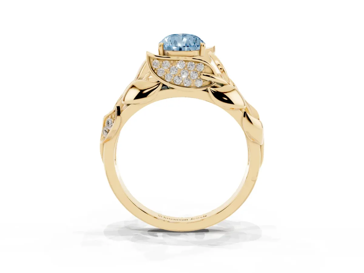 Fancy Blue Pear Cut Diamond Leaf-Inspired Engagement Ring with Round Accents and Prong Setting Yellow gold