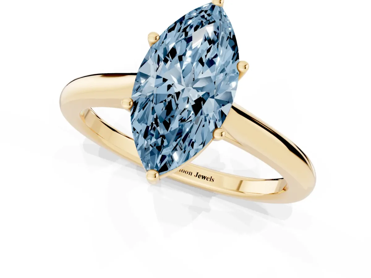 Fancy Blue Marquise Cut Cut Solitaire Ring with Cathedral Band and Four-Prong Setting Yellow gold
