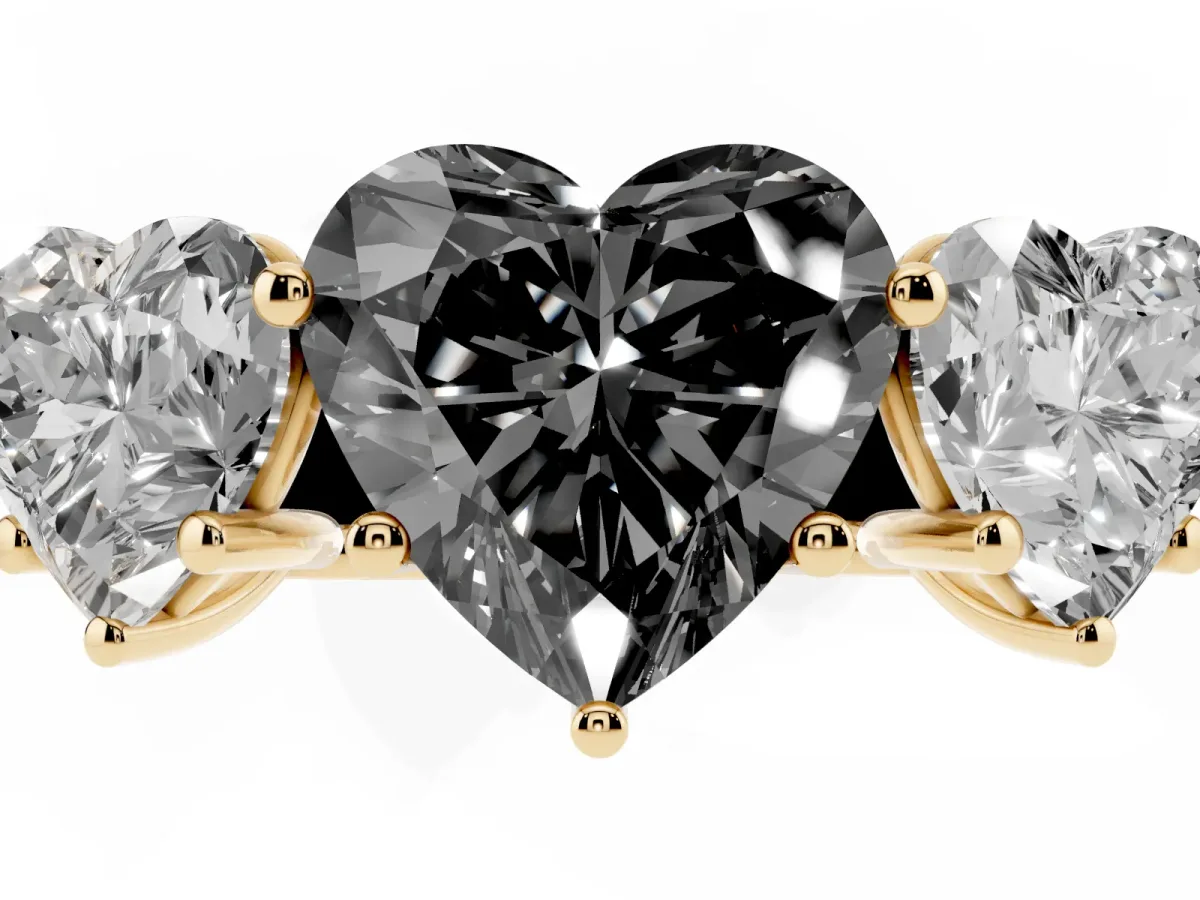 Fancy Black Heart Cut Three-Stone Diamond Ring with Prong Setting on a Classic Band Yellow gold