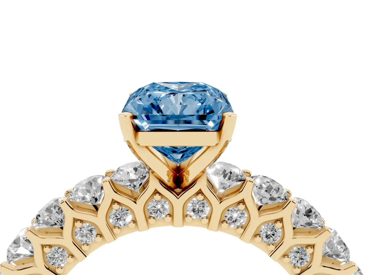 Fancy Blue Radiant Cut Diamond Solitaire Ring with Shared Prong Pavé Band and Four-Prong Setting Yellow gold