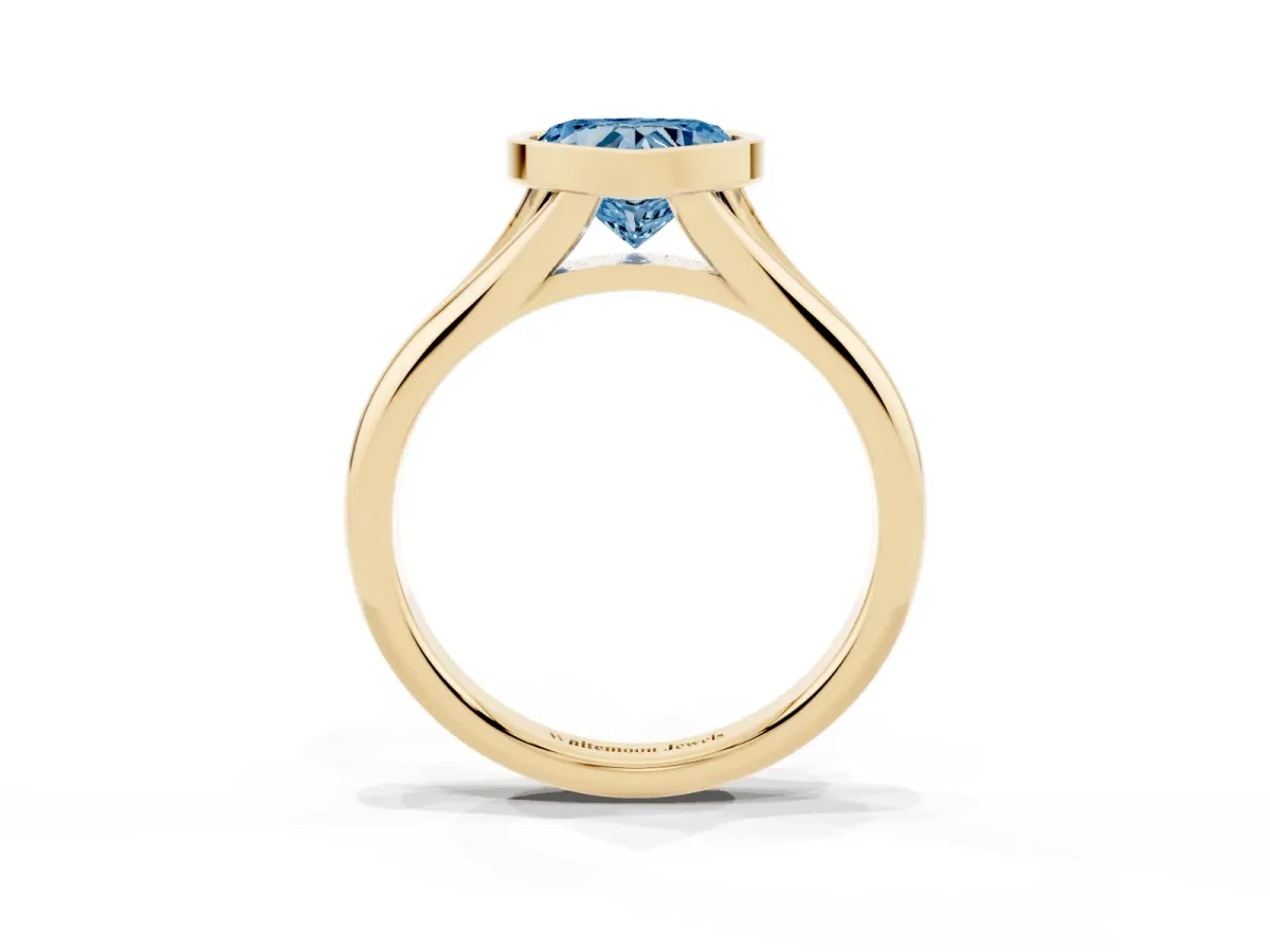 Fancy Blue Bezel Set Heart Cut Solitaire Diamond Ring with Smooth Band Yellow gold