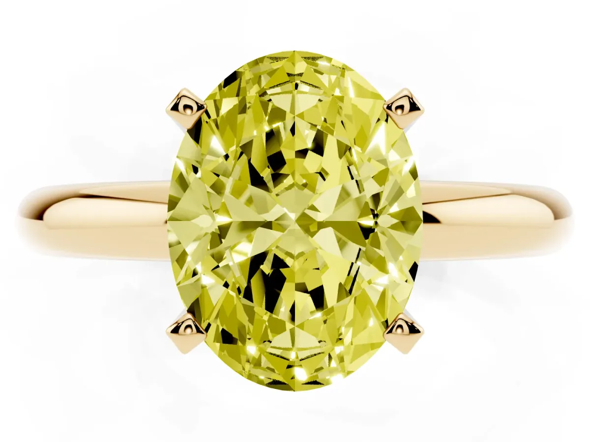 Fancy Yellow Oval Cut Diamond Solitaire Engagement Ring with Round Band and Four-Prong Setting Yellow gold