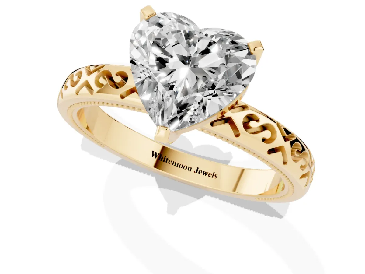 Heart Cut Solitaire Engagement Ring with Scrollwork Band and Four-Prong Setting Yellow gold