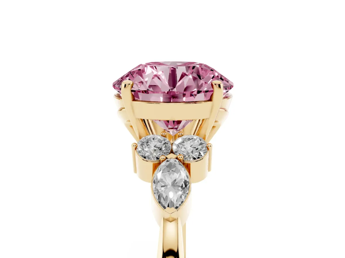 Fancy Pink Round Cut Brilliant Diamond Solitaire Ring with Pear Side Stones and Four-Prong Setting Yellow gold