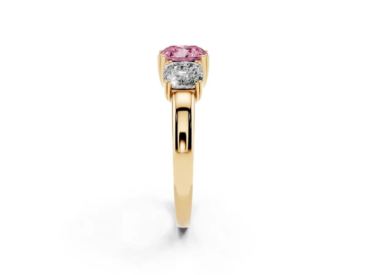 Fancy Pink Three-Stone Cushion Cut Cut Diamond Ring with Channel Set Band and Four-Prong Setting Yellow gold