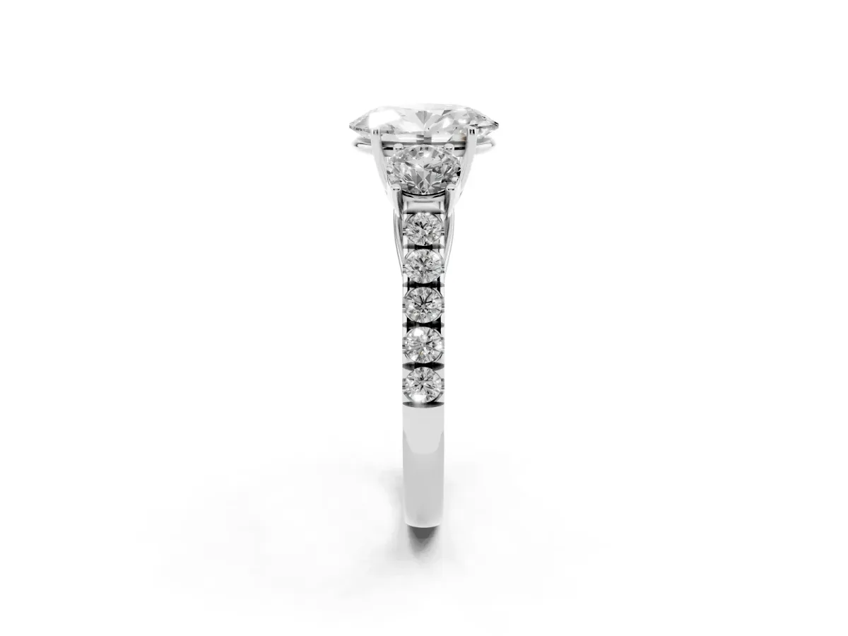 Oval Cut Cut Diamond Three-Stone Ring with Round Side Stones and Pavé Band Silver