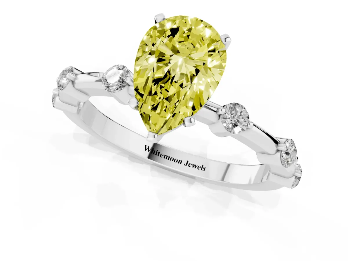 Fancy Yellow Pear Cut Solitaire Diamond Ring with Bezel Set Side Stones and Prong Setting Platinum