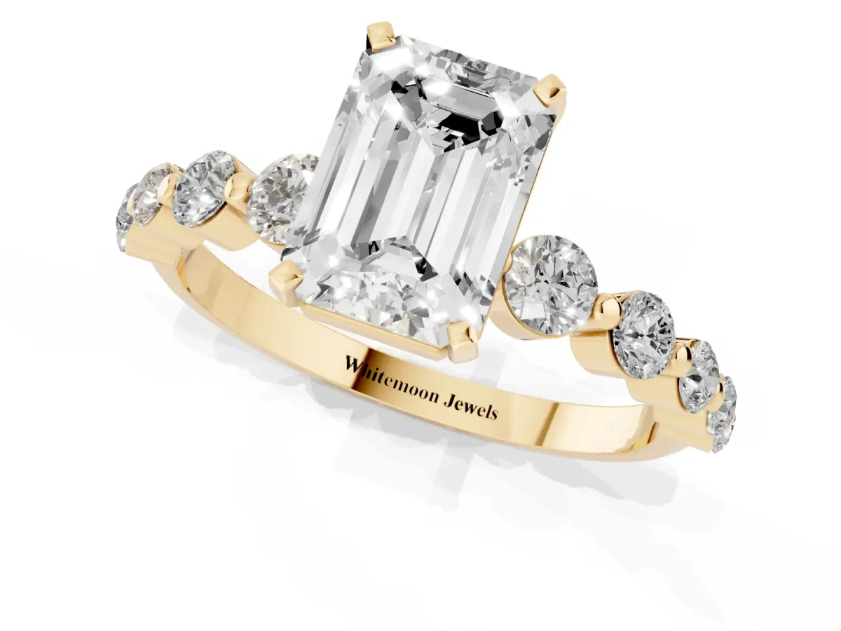 Emerald Cut Solitaire Diamond Ring with Pave Band and Four-Prong Setting Yellow gold
