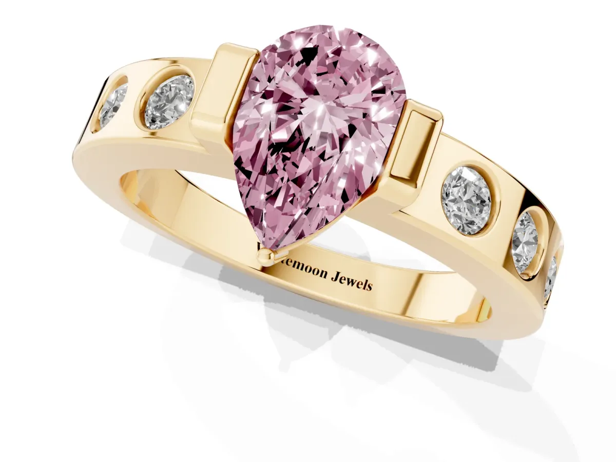 Fancy Pink Pear Cut Brilliant Channel-Set Diamond Ring with Bezel Prong Setting Yellow gold