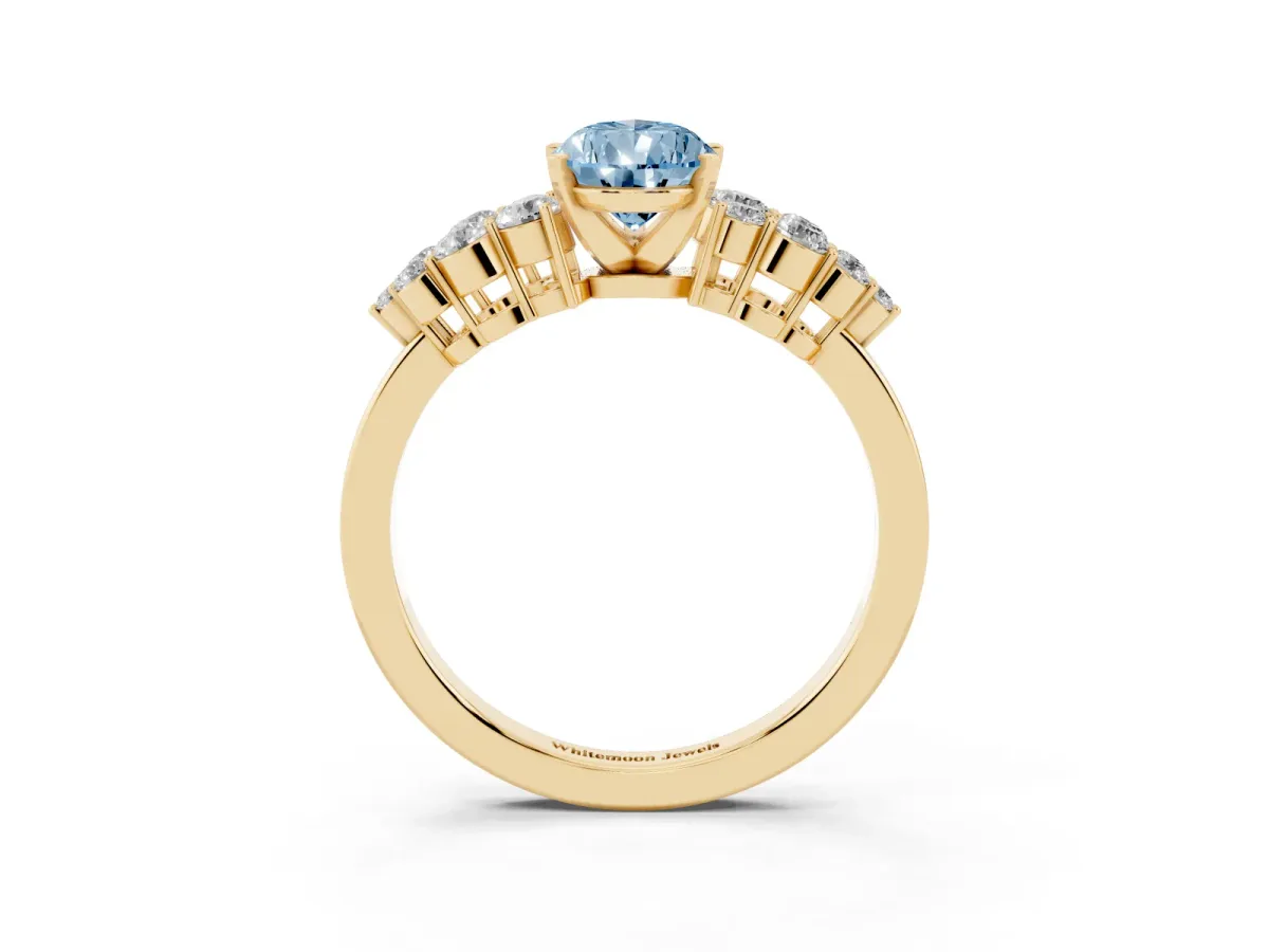 Fancy Blue Pear Cut Cluster Diamond Engagement Ring with Pavé Band and Four-Prong Setting Yellow gold
